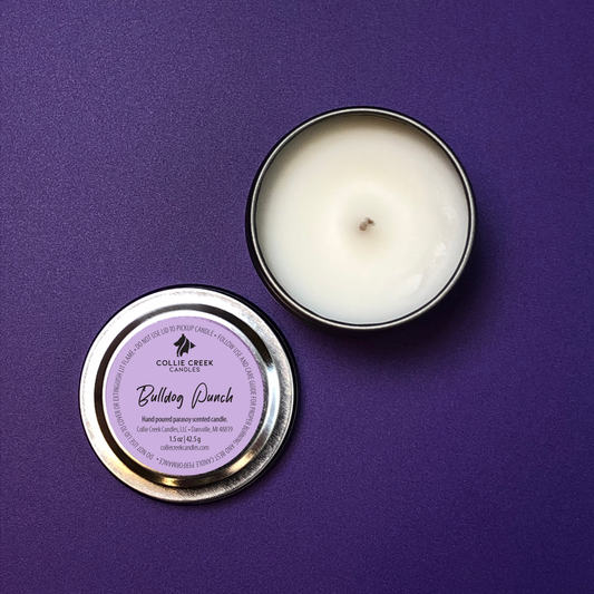 Small silver tin with a purple label reading Bulldog Punch photographed upon a purple background