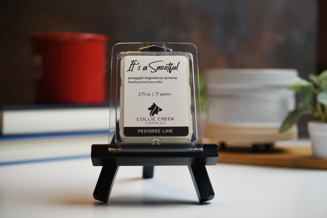 It's a Snootful wax melt a 2.75 oz (77 gram) product in a clear plastic clam shell container.