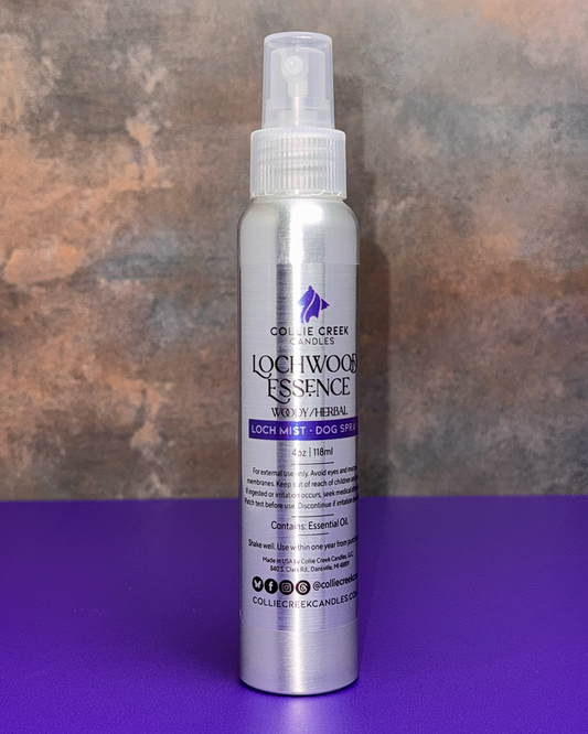 Lockwood Essence Dog Spray. A sliver 4 ounce bottle with a spray top. A silver label with black and purple writing.