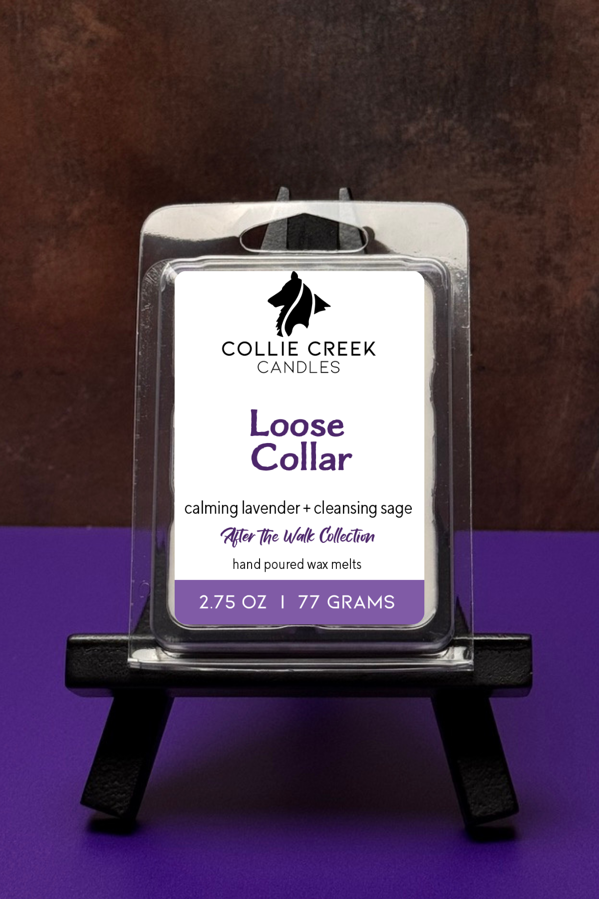 Single wax melt in a clear clam shell on a colored background, Loose Collar in purple on a white label.