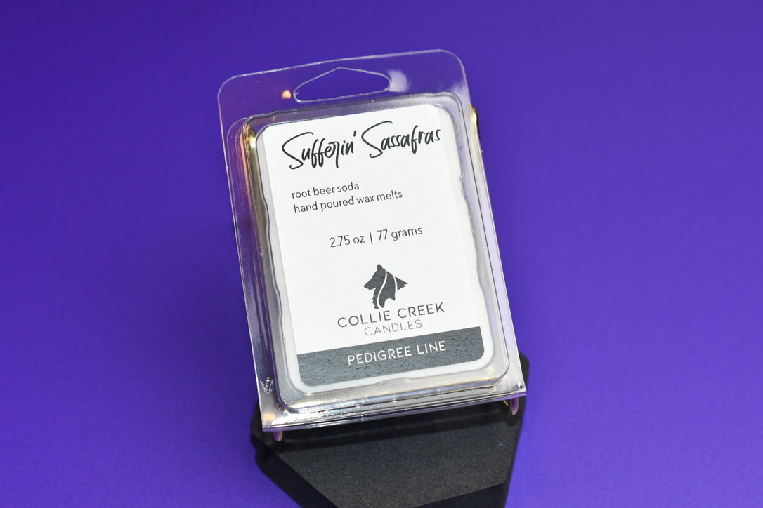 Root beet scented 6-cavity wax melt called Sufferin' Sassafras on purple background.