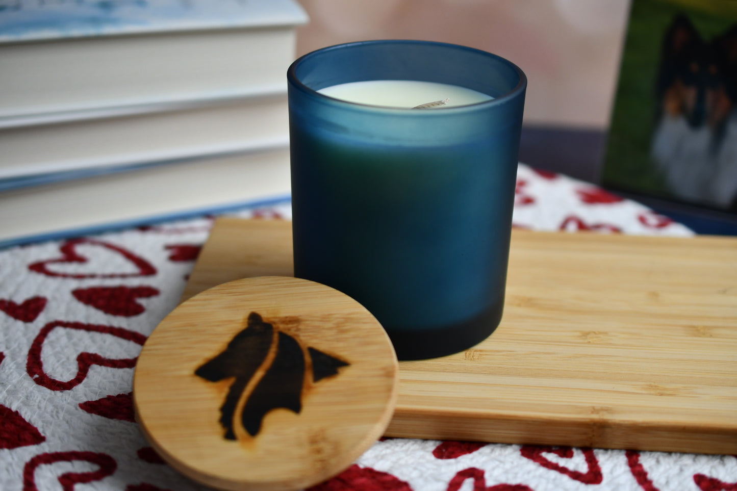 Frosted, suede blue candle jar holds creamy, natural colored single-wick parasoy candle. The "Gotcha Day" candle smells like birthday cake and makes a great gift.