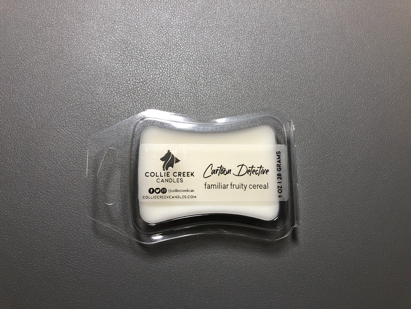 Photo of 1 ounce or 28 grams single-cube in an hourglass shaped container wax melt in a natural wax color. Scent profile is a familiar, fruity cereal - you can even smell the yummy dust from the bottom of the cereal box, from Collie Creek Candles.
