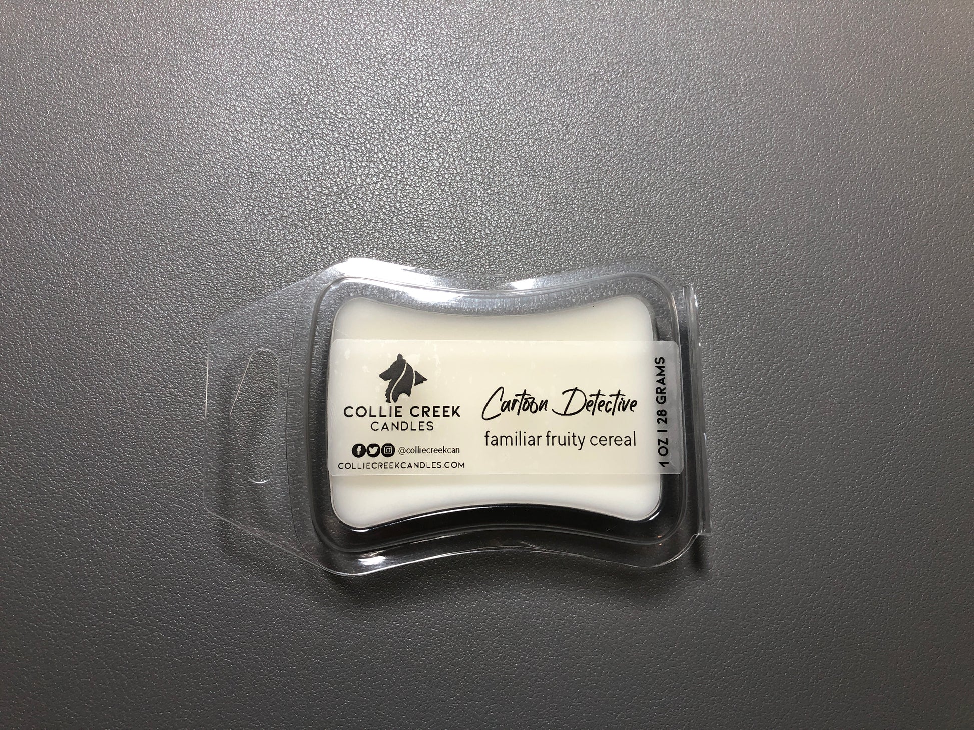 Photo of 1 ounce or 28 grams single-cube in an hourglass shaped container wax melt in a natural wax color. Scent profile is a familiar, fruity cereal - you can even smell the yummy dust from the bottom of the cereal box, from Collie Creek Candles.