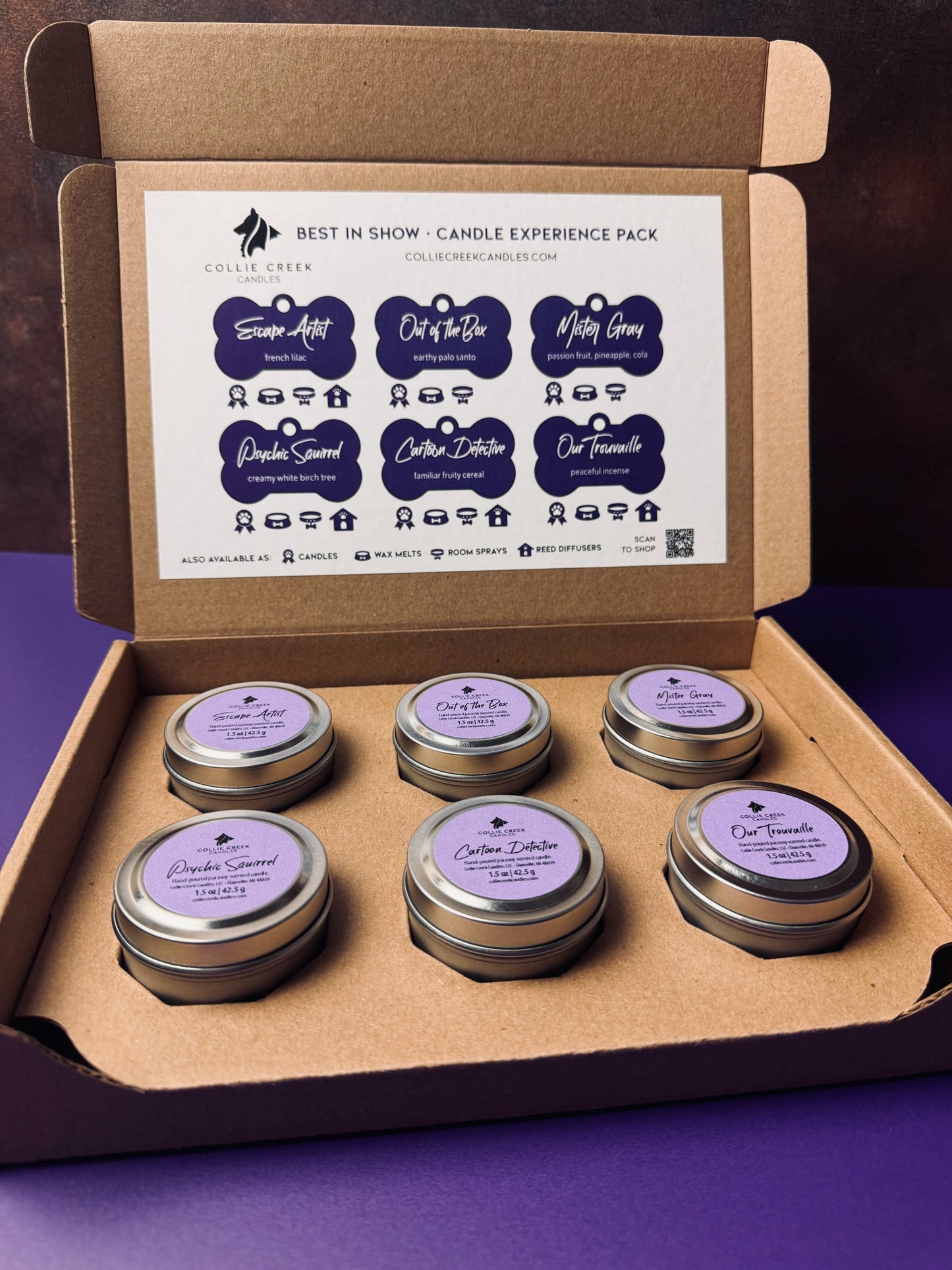 Box of candle experience pack with six small candles and labels on a purple background