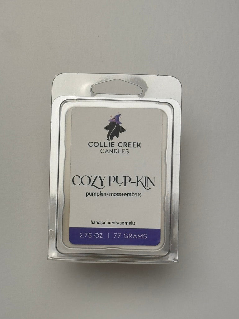 Collie Creek Cozy Pup-Kin candle wax melt package on a gray background