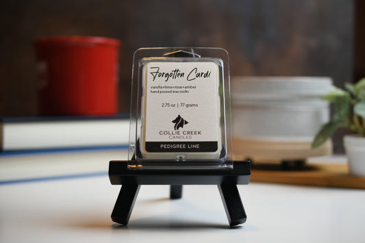 Forgotten Cardi wax melt a 2.75 oz (77 gram) product in a clear plastic clam shell container.