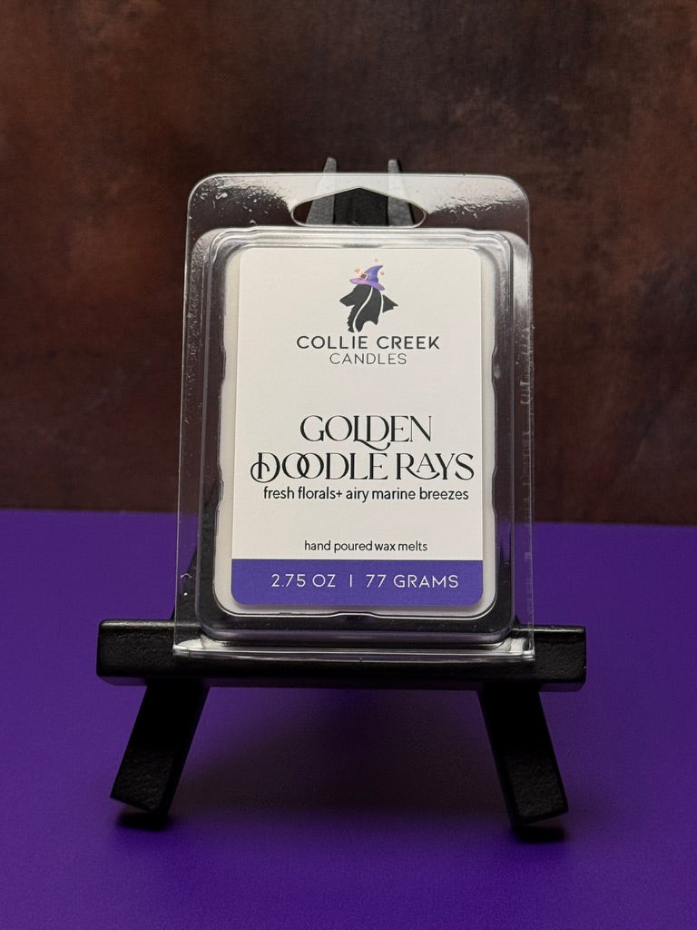 Collie Creek Candles Golden Doodle Rays wax melt  wax melt packaging on a stand with a dark background