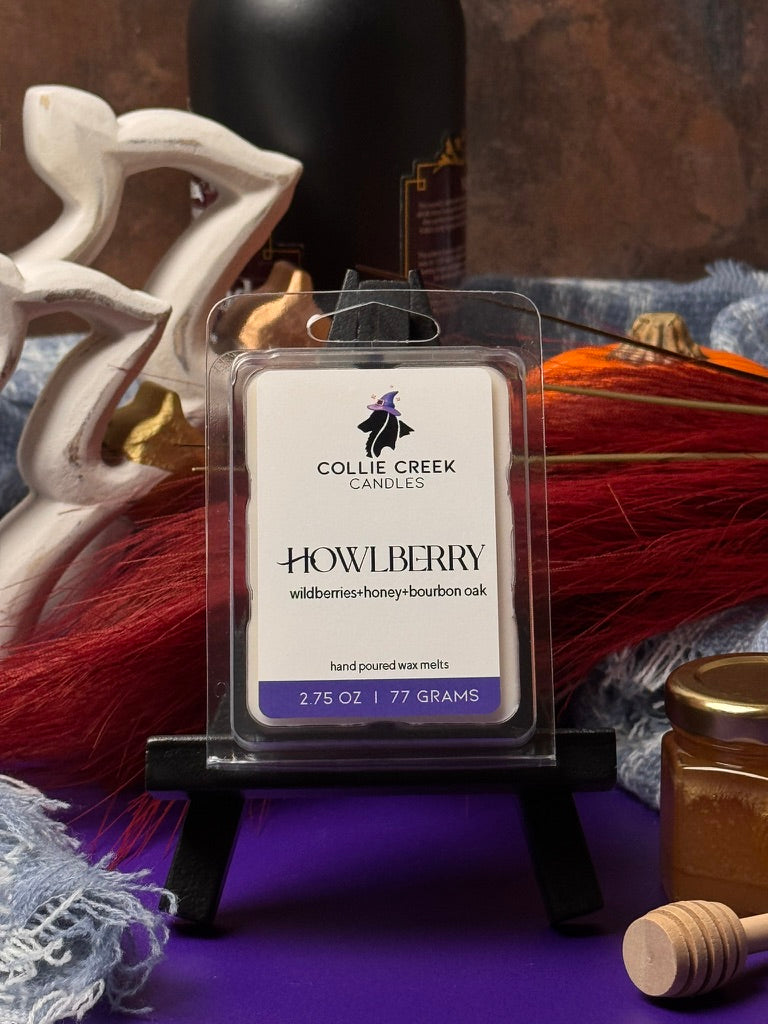 Collie Creek Howlberry wax melt packaging with decorative items in the background