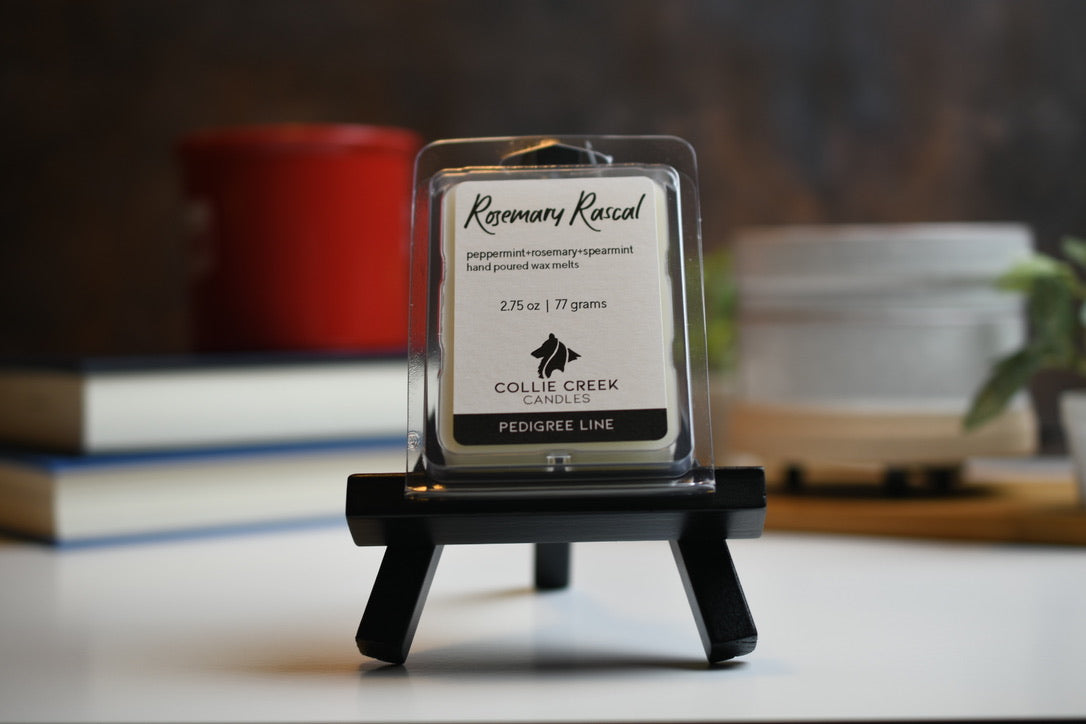 Rosemary Rascal wax melt a 2.75 oz (77 gram) product in a clear plastic clam shell container.