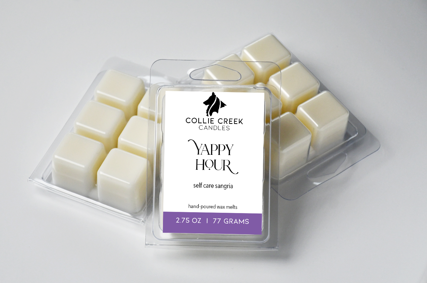 Grouping of naturally colored wax melts in clam shells. The label reads Yappy Hour, self care sangria below the Collie Creek Candles logo.