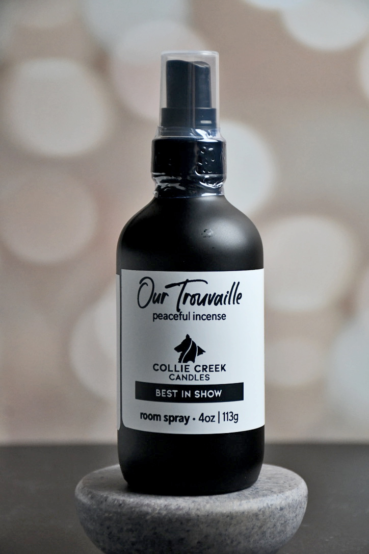 4 oz matte black bottle with white label with black lettering. This room spray comes in many scent profiles. This scent profile called Our Trouvaille (lucky find in French) and is a peaceful incense, from Collie Creek Candles.